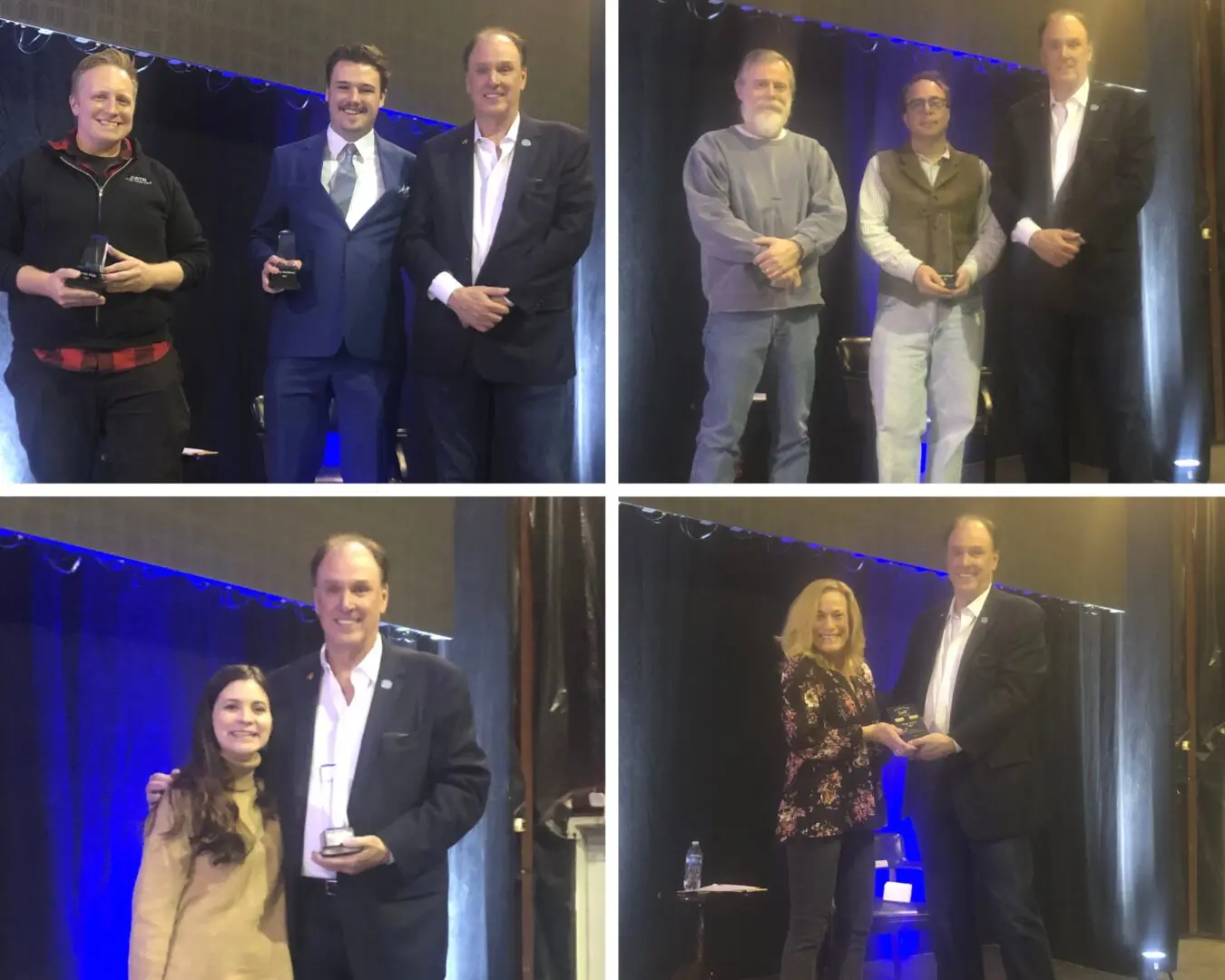 People receiving awards on stage in a formal event.