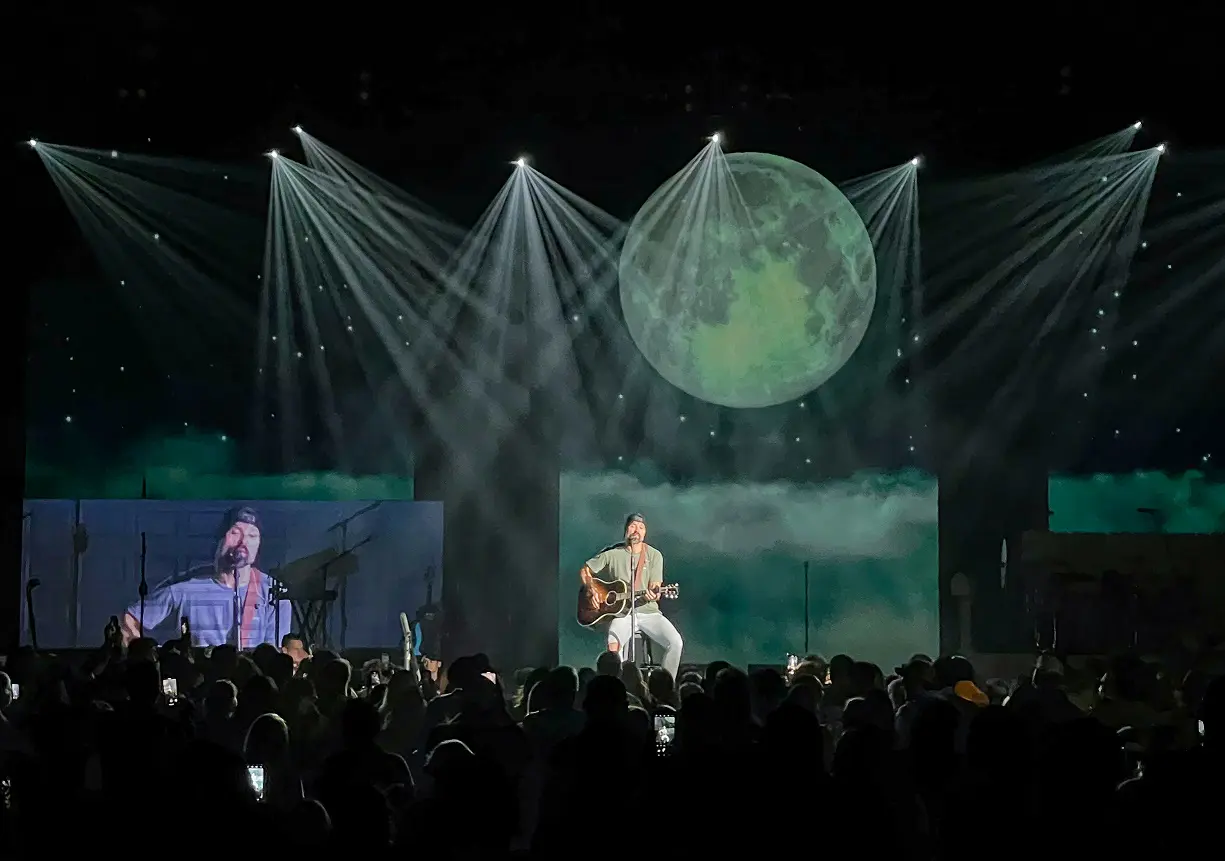 A beautiful sunset with vibrant orange and pink hues over a calm sea.