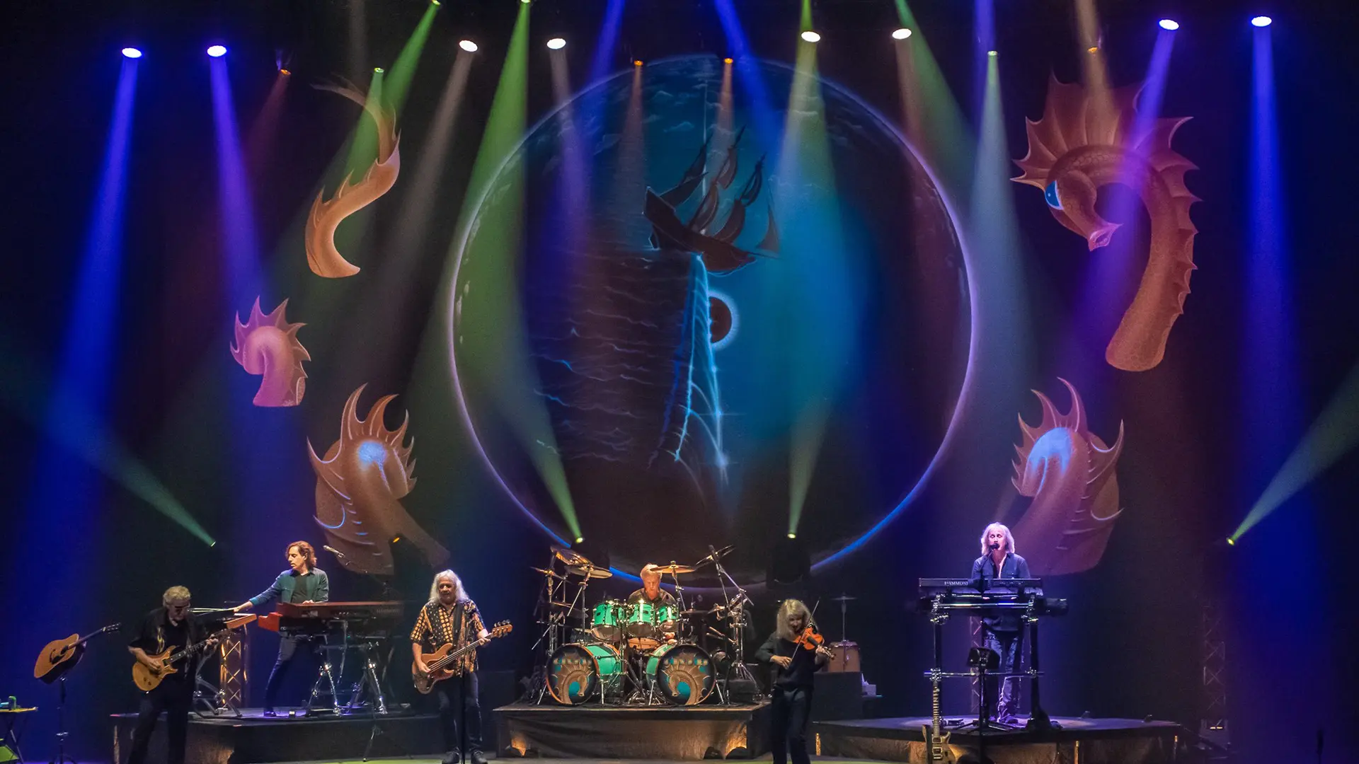 A beautiful sunset with vibrant orange and pink hues over a calm sea.