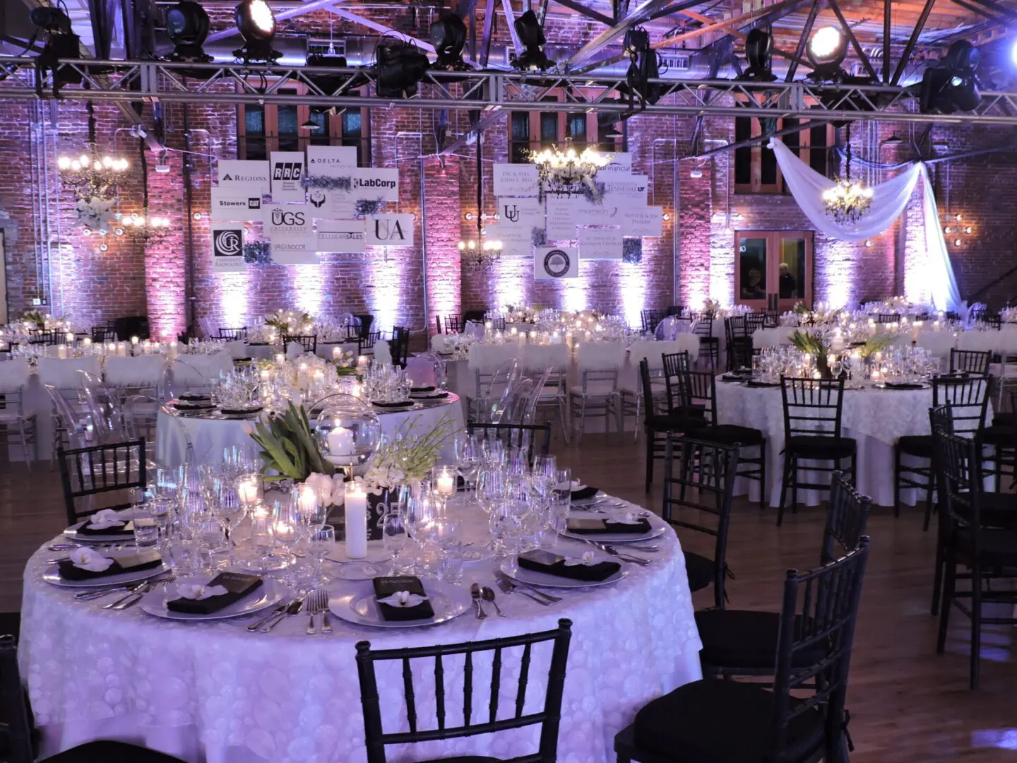 Elegant banquet hall with round tables set for a formal event.
