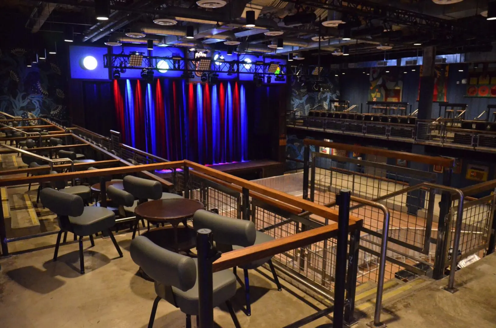 Empty theater with stage and seating areas.