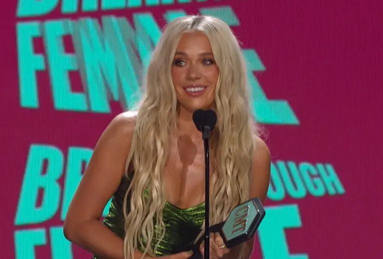 A beautiful sunset with vibrant orange and pink hues over a calm sea.