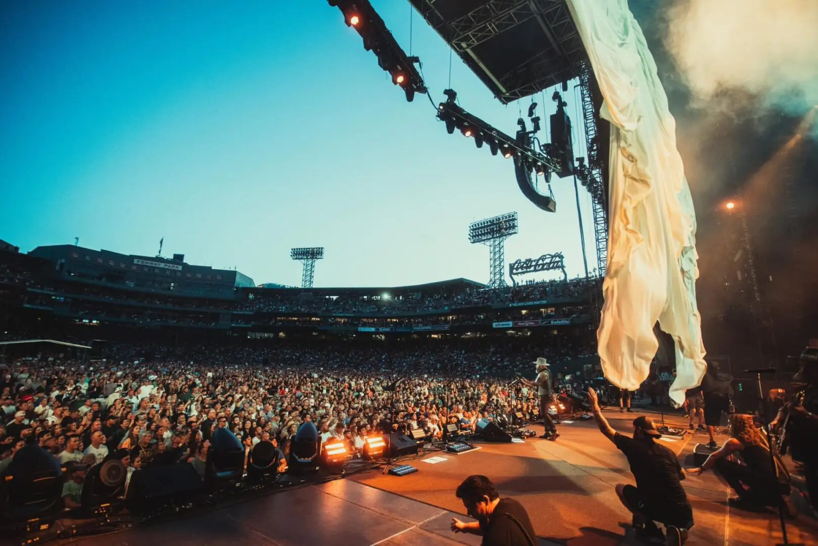 A beautiful sunset with vibrant orange and pink hues over a calm sea.