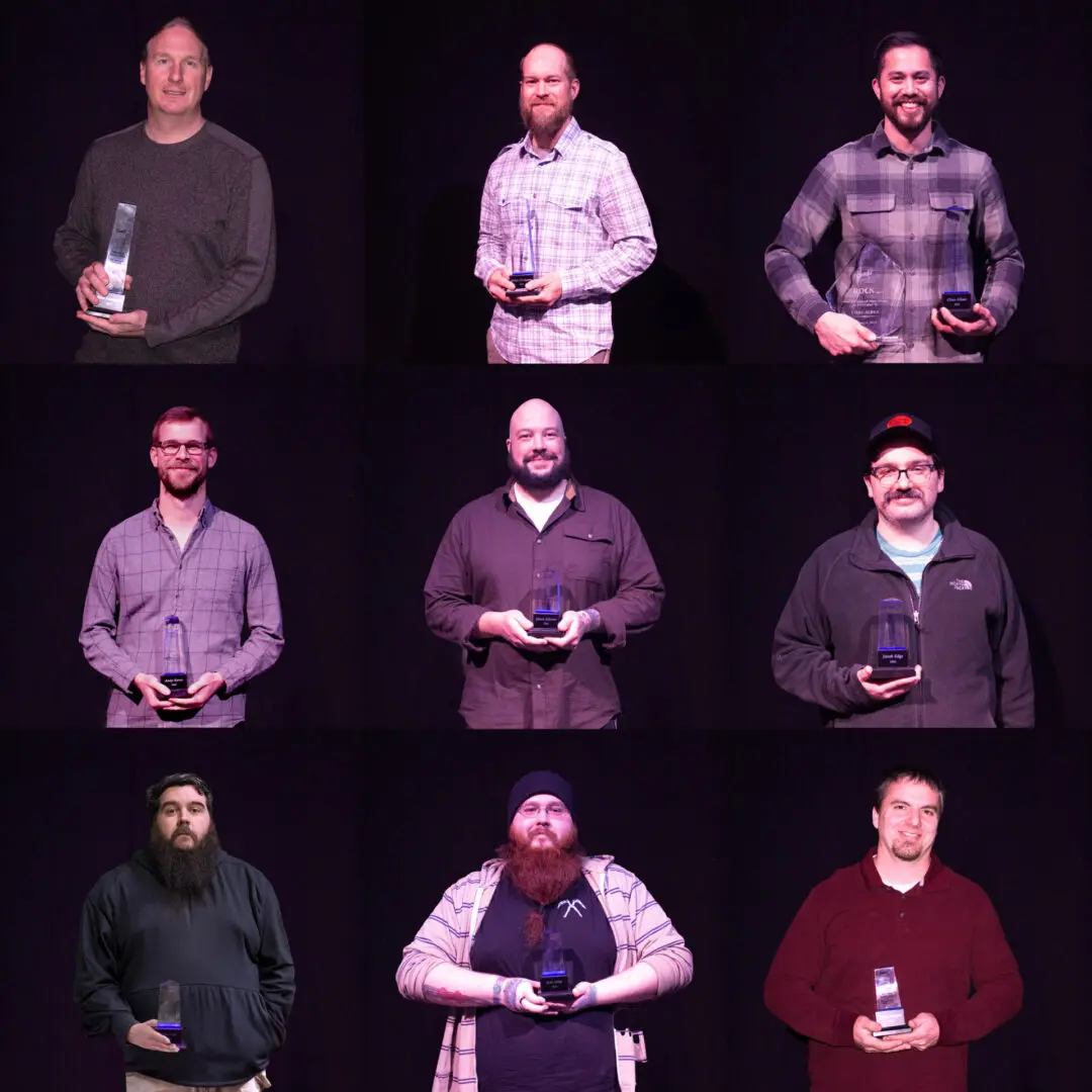 Seven men holding awards, posing in a grid against a black background.