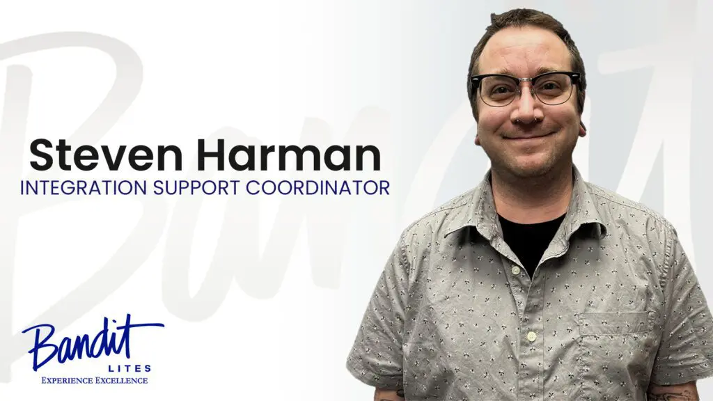 Portrait of a smiling male support coordinator named Harman.