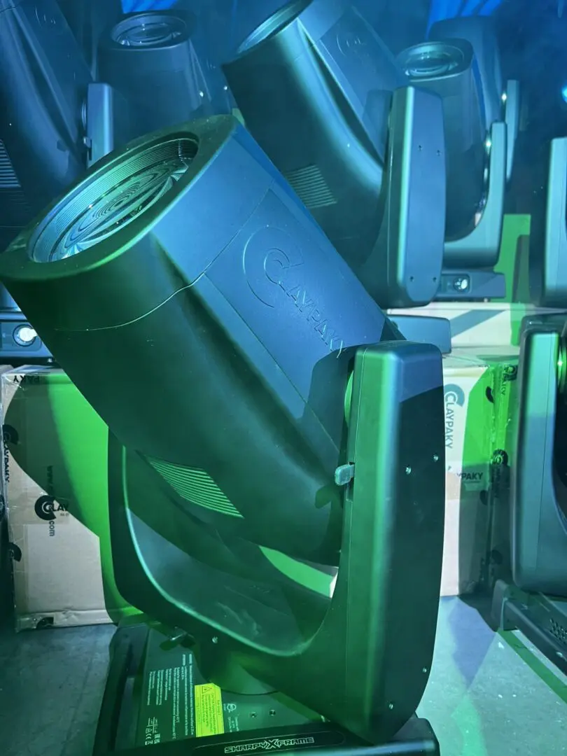 A green industrial machine part with a cylindrical opening.