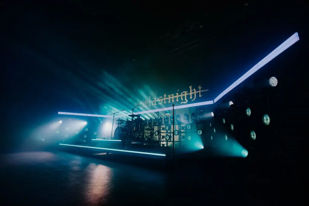 A futuristic nightclub scene with neon lights and a DJ booth.