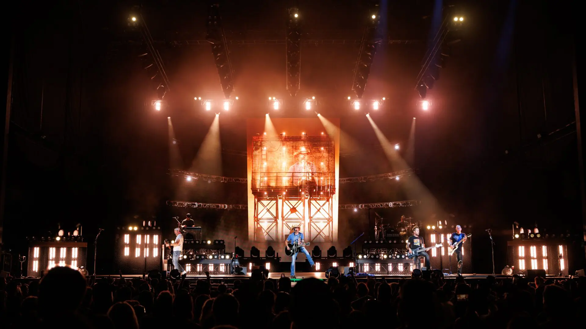 A grand stage setup with bright lights and a glowing centerpiece.