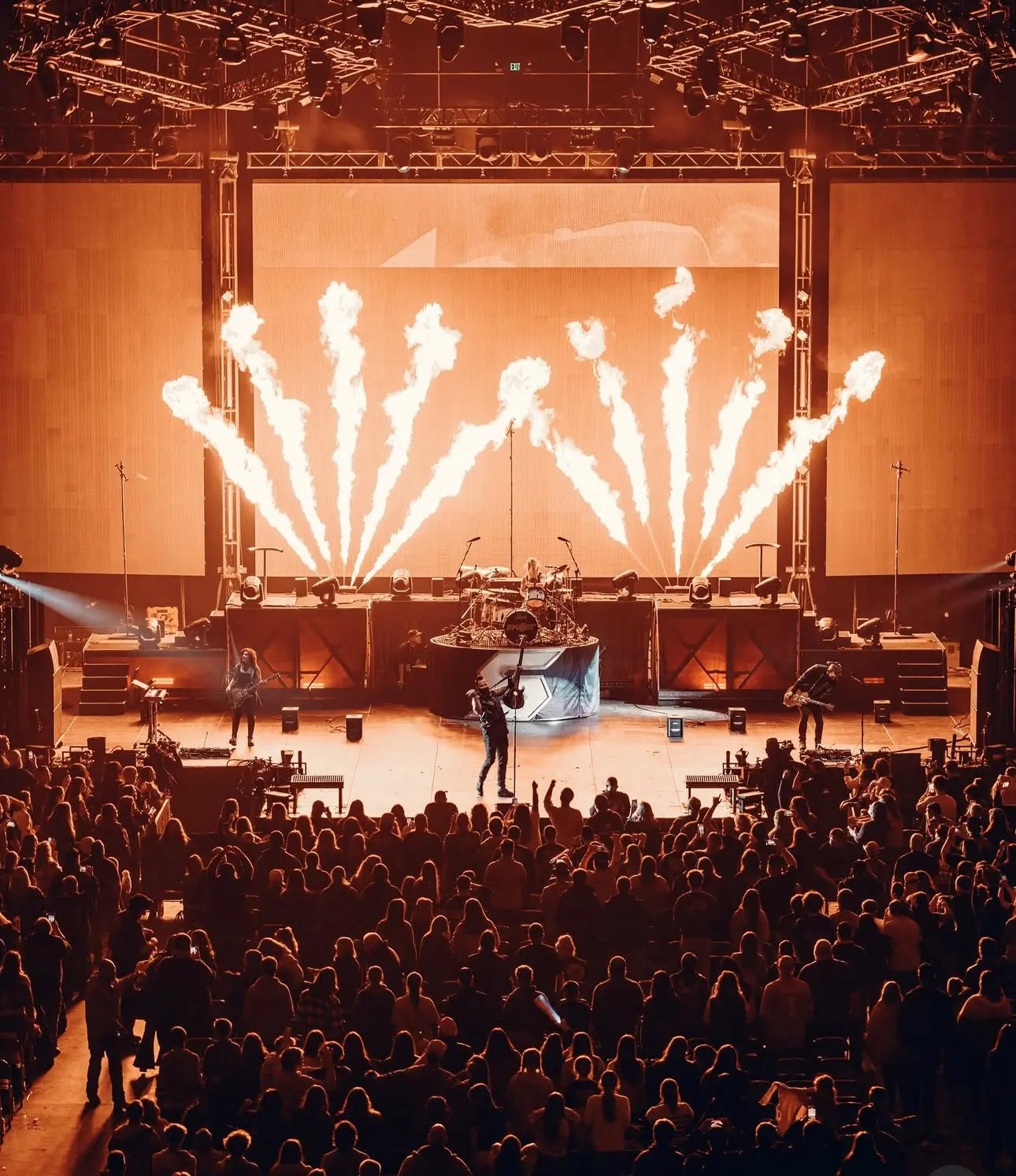 A beautiful sunset with vibrant orange and pink hues over a calm sea.