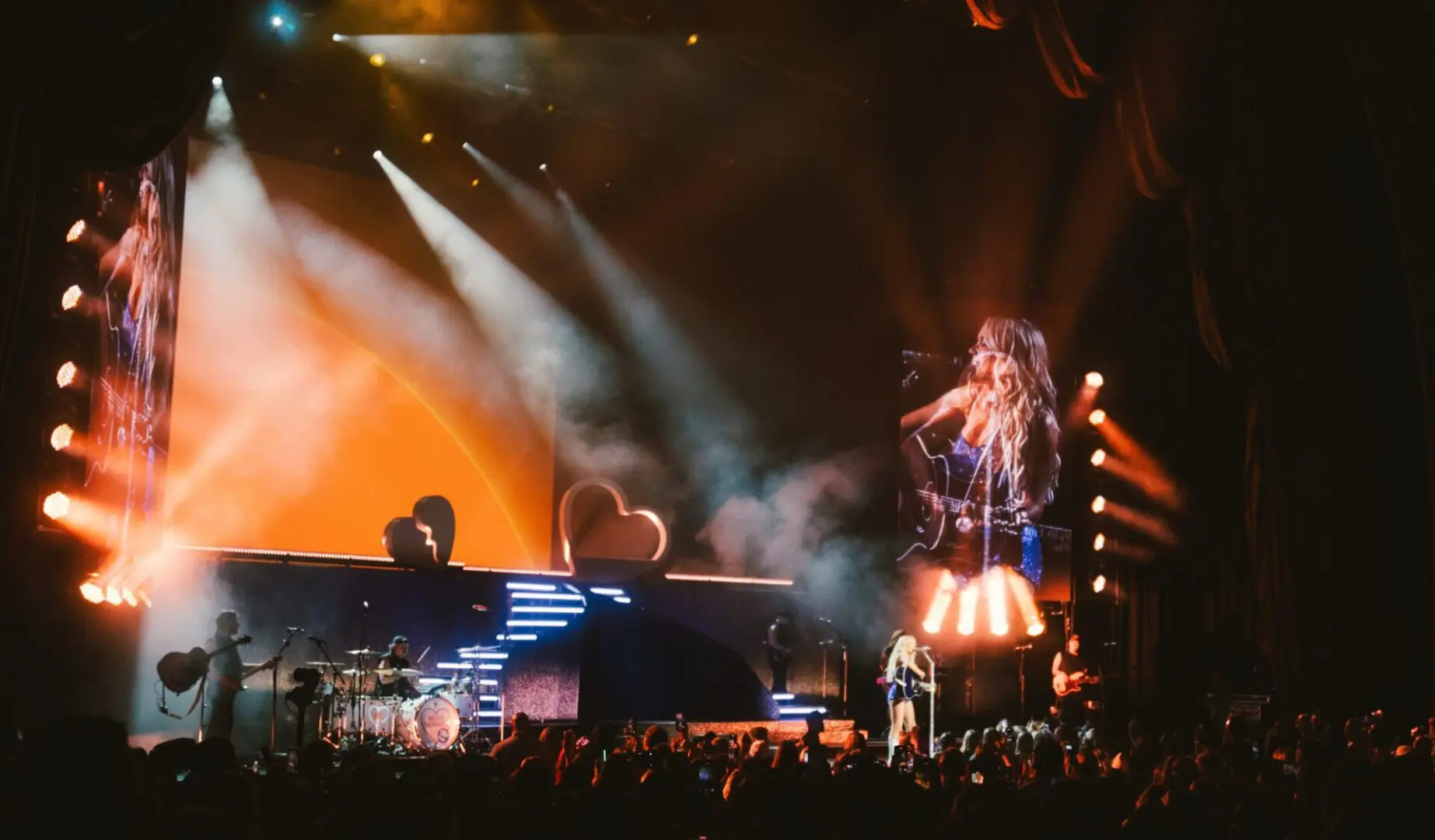 A beautiful sunset with vibrant orange and pink hues over a calm sea.