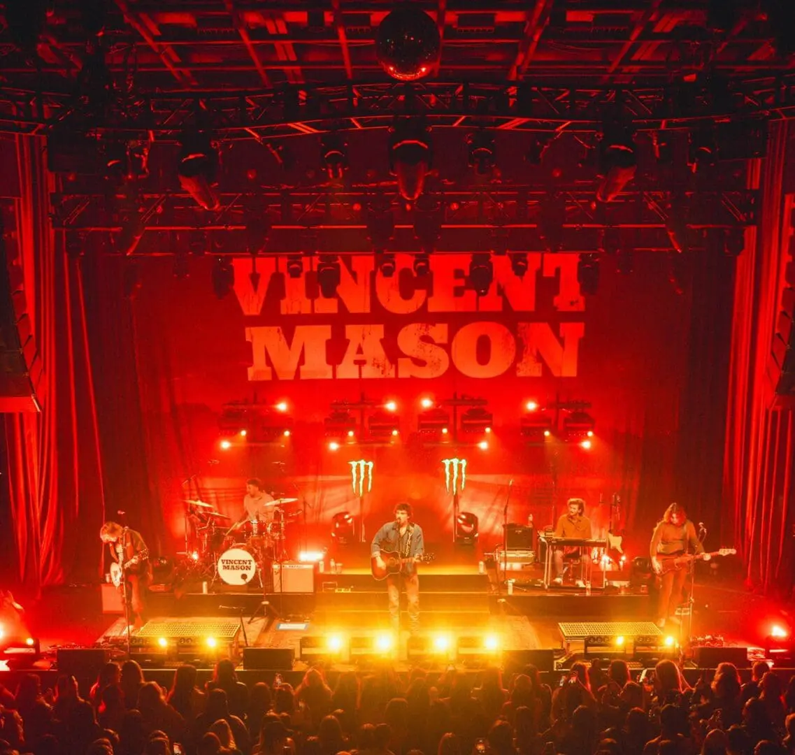 A beautiful sunset with vibrant orange and pink hues over a calm sea.