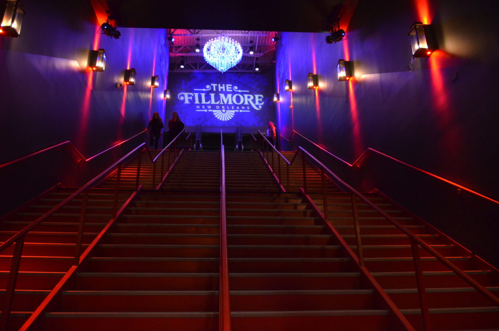Staircase leading to The Fillmore theater entrance with vibrant purple lighting.