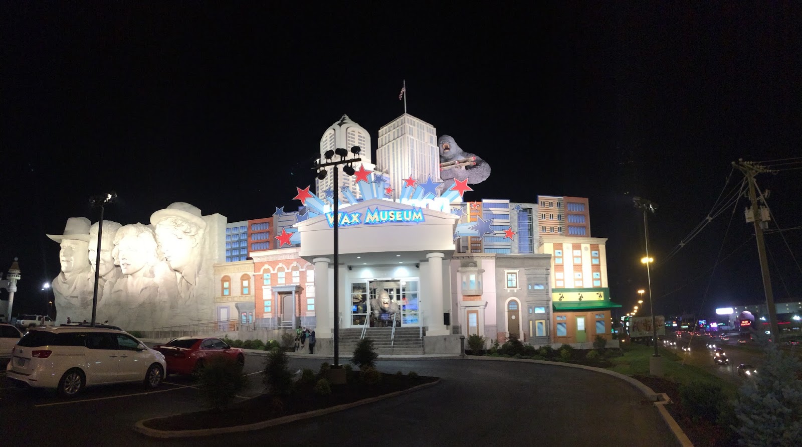 Brightly lit casino entrance at night with colorful signage.